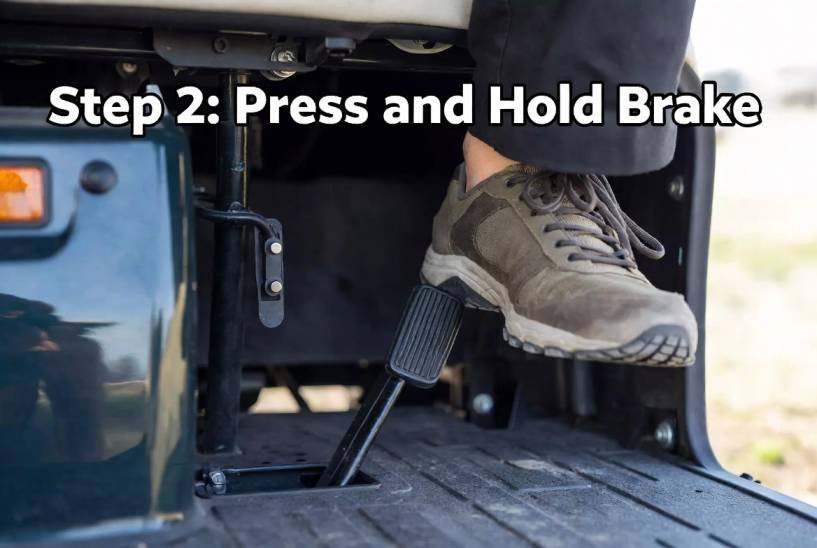 Press and hold the brake pedal firmly